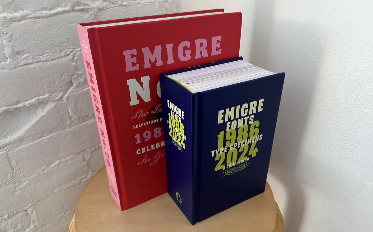 Two books standing upright in three-quarter view on a stool. The larger red book in back is Emigre No. 70, the smaller thicker blue book in front is Emigre Fonts: Type Specimens, 1986–2024.